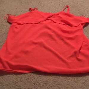 Peach cross back tank top shirt.